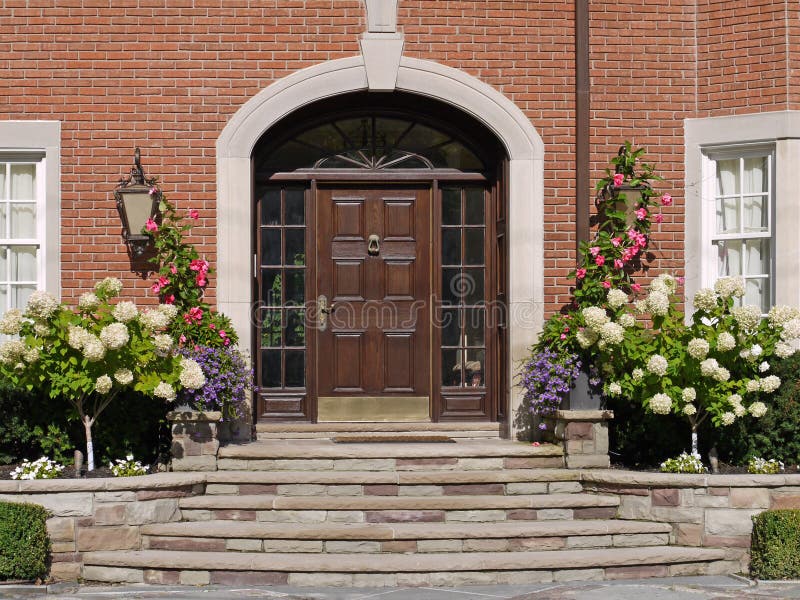 Front door with hydrangeas. And flagstone steps stock images